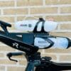Between-the-arms hydration riser for triathlon bikes